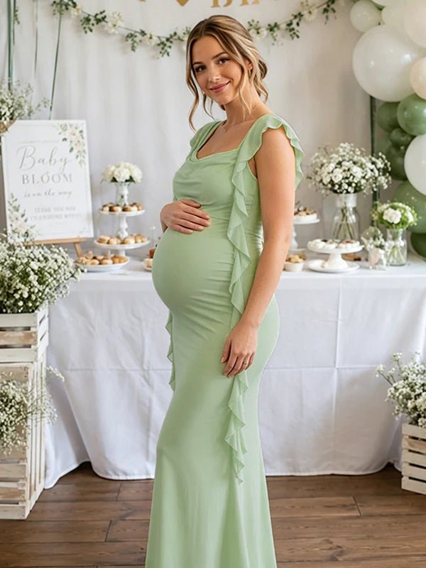 Groene zwangerschaps maxi jurk met gedrapeerde plooien.