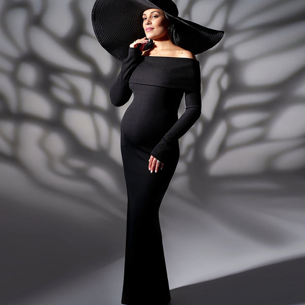 Zwarte zwangerschaps maxi jurk met off-shoulder en zeemeerminmodel, ideaal voor fotoshoot en avondfeest.