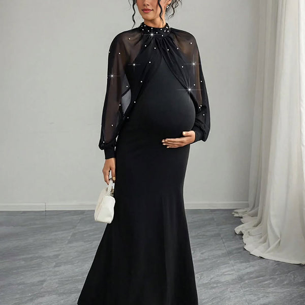 Zwarte zwangerschaps maxi cocktailjurk met pareltule, zeemeerminmodel en elegante pasvorm.