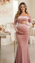 Fluwelen zwangerschapsjurk met off shoulder design en open rug.