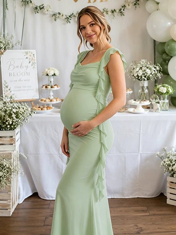 Groene zwangerschaps maxi jurk met open rug en ruches.
